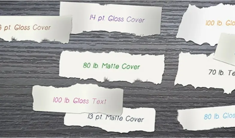 Samples of gloss and matte paper stocks in different weights